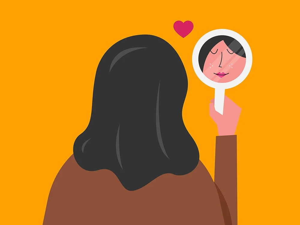 یک دختر که در آینه خود را نگاه میکند-همدلی با خود